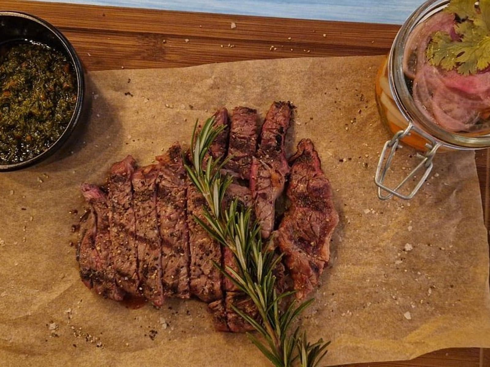 Phone snap — steak shot on a phone under kitchen lighting, then relit