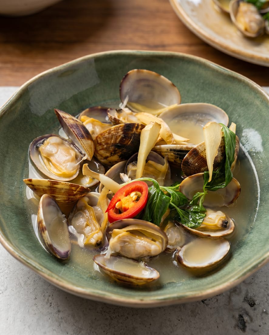 Relit seafood menu photo of the same platter with glistening oysters, true-coral salmon and fresh colour