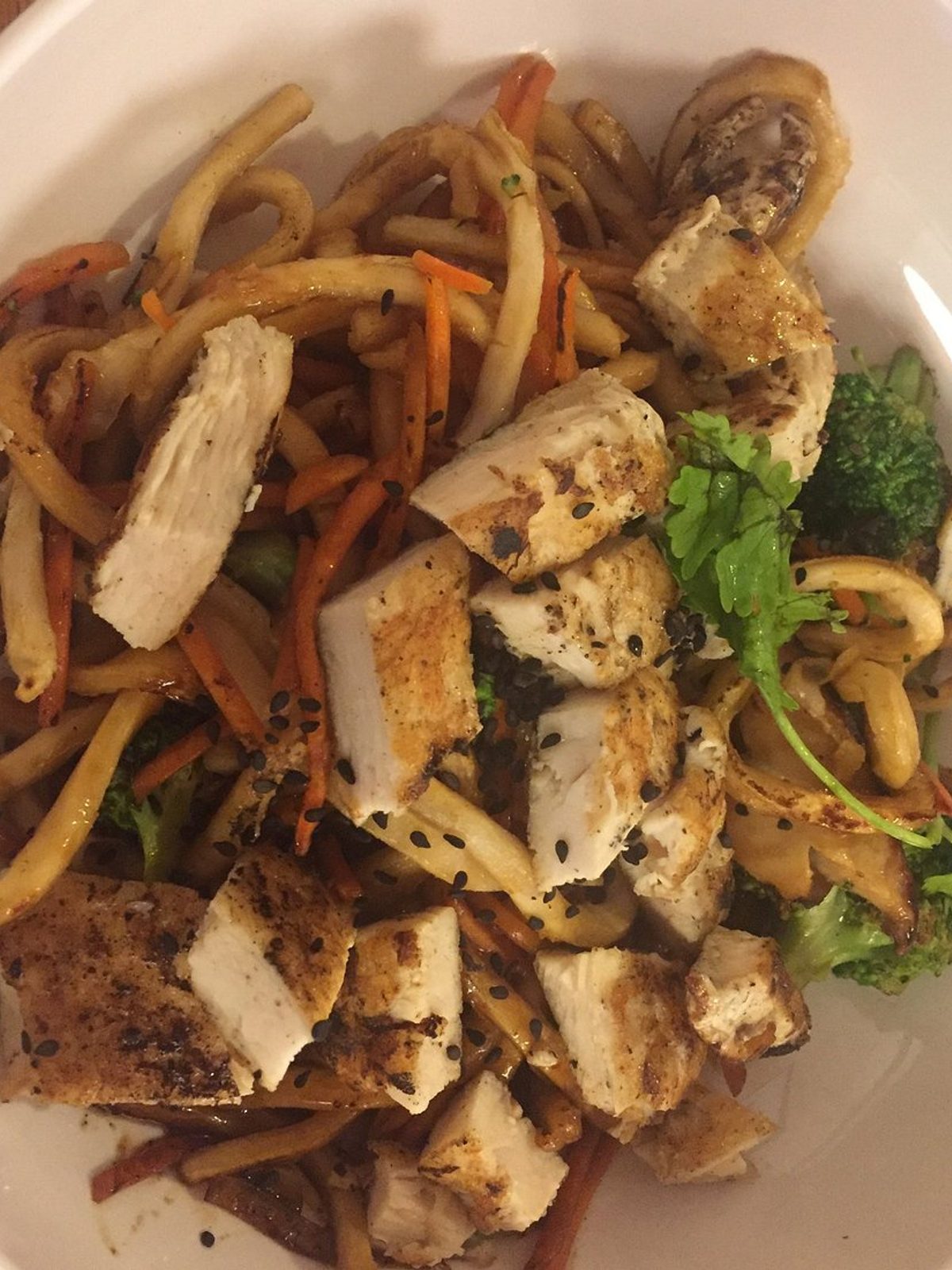 Before: dim phone photo of a plate of stir-fried noodles with vegetables on a kitchen counter